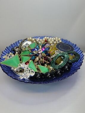 Mixed Jewelry In A Beautiful Blue Glass Bowl